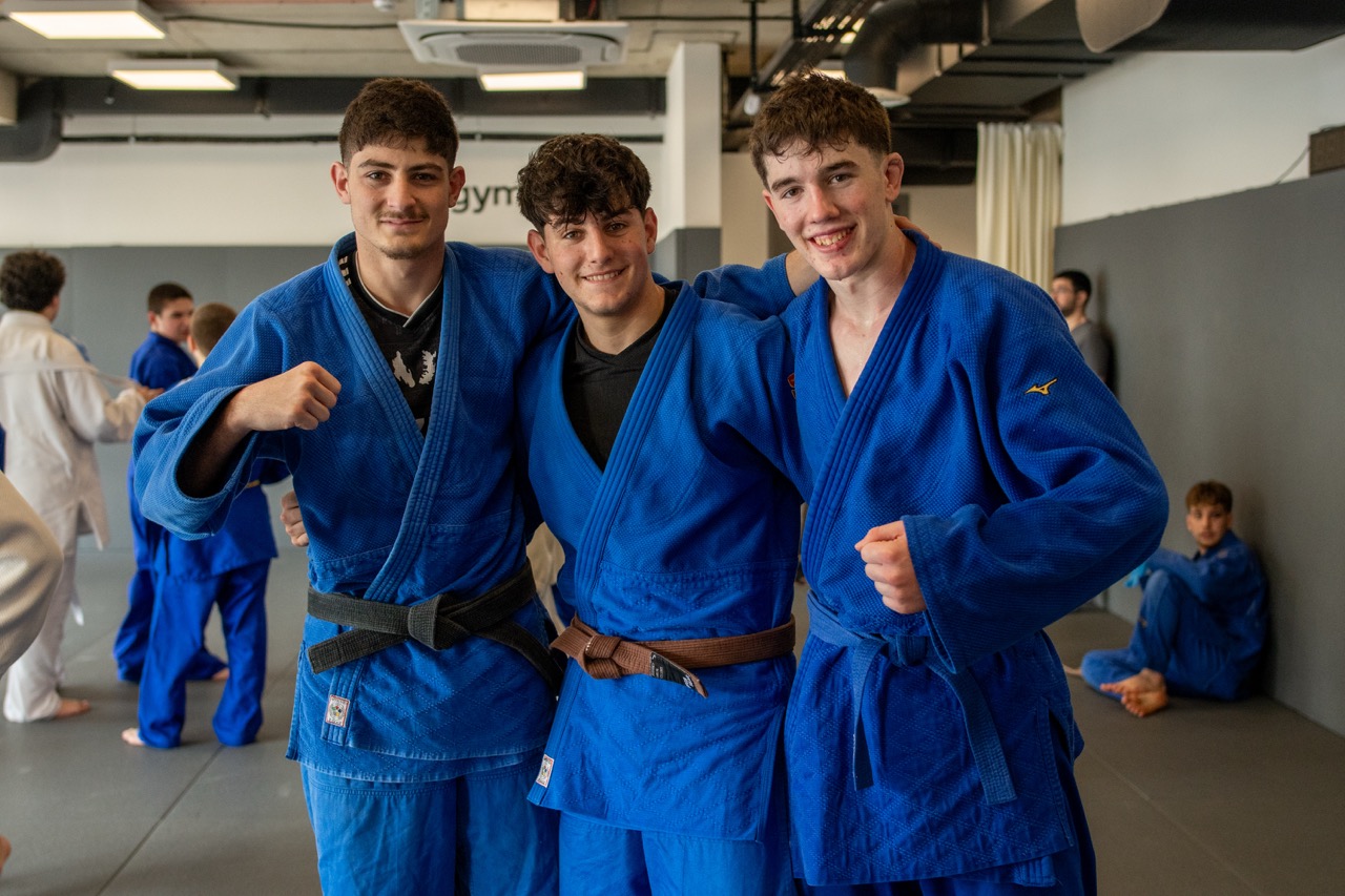 Visiting group standing together inside the training facility